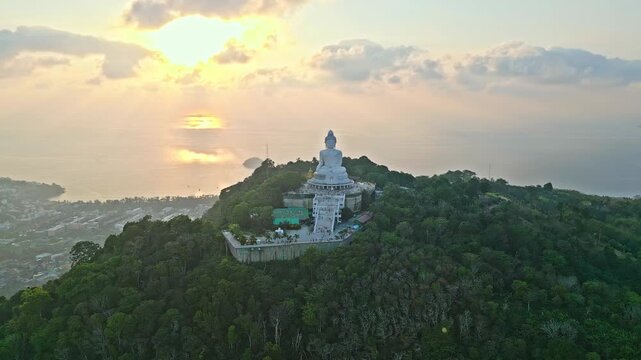 Golden hour orbit of big buddha temple over phuket thailand
