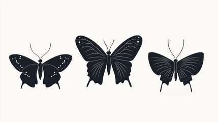 Silhouettes of three butterflies on white background.  Possible use for digital art, graphic design