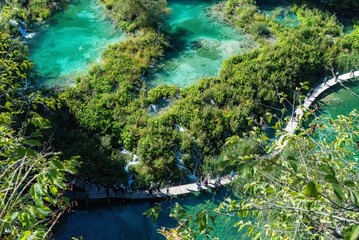 Panoramic shot from above of the wonderful Plitvice Lakes surrounded by a colourful autumn forest