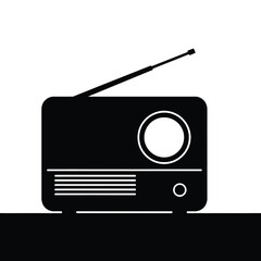 A black and white minimalist illustration of a vintage radio with an antenna extended up silhouette