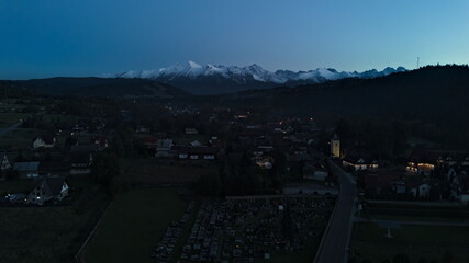 Jurgów village at dusk with Tatra mountains in background, Poland