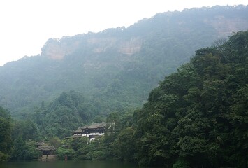 mountain landscape with fog and trees