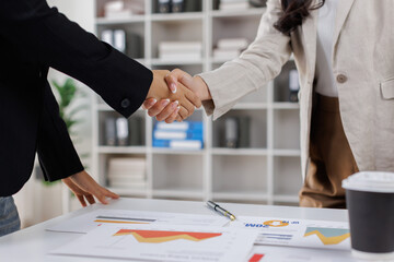 Business handshake for teamwork of business merger and acquisition,successful negotiate,hand shake,two businessman shake hand with partner to celebration partnership and business deal concept

