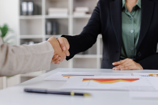 Business handshake for teamwork of business merger and acquisition,successful negotiate,hand shake,two businessman shake hand with partner to celebration partnership and business deal concept

