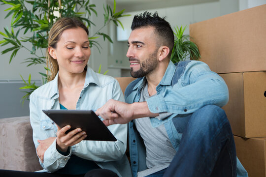 portrait of young couple relocating together