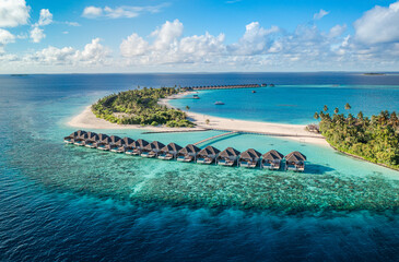 Tranquil Maldives aerial landscape tropical luxury beach resort water villas. Sunshine pristine turquoise sea paradise island amazing ocean horizon exotic top travel destination summer best vacation