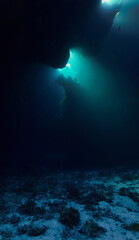 Cathedrals of light - Underwater photo of rays of sunlight inside caves. and tunnels From scuba cave diving in the south of Egypt. St:Johns reef.