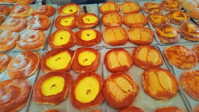 Traditional Majorcan ensaimadas pastries dusted with sugar at Palma market