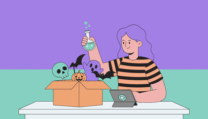 A woman creating Halloween crafts and spooky decorations while watching a tutorial online