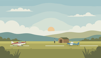 Pilot with small propeller planes at a rural airfield during sunset Aviation travel hobby leisure