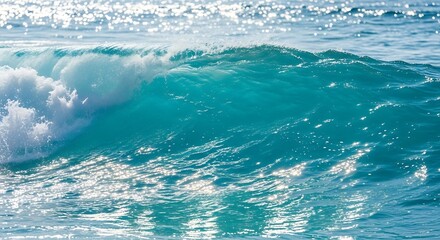 Majestic turquoise wave cresting under bright sunlight reflecting glitter