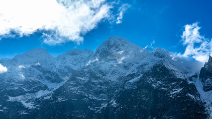 Snowy Mięguszowiecki Summit and Tatra Peaks under Dramatic Sky, Zakopane, Poland © Marcin