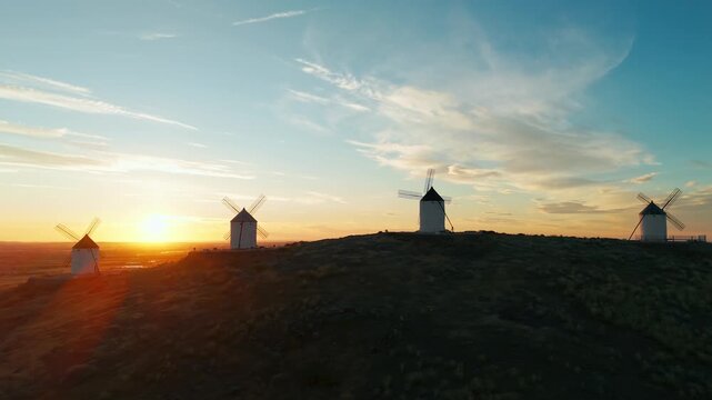 Aerial view of the windmills of Consuegra at sunrise, Castilla-La Mancha, Spain.