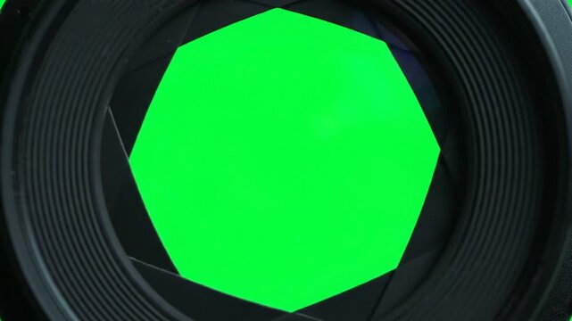 camera lens close up on green screen