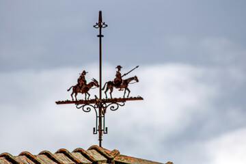 Obraz premium Weather vane on the roof