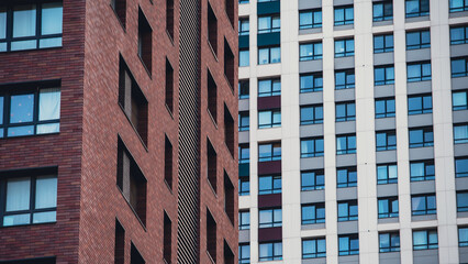 Fototapeta premium mirrored windows of the facade of an office building