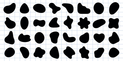 Collection of abstract black shapes on a grid background. Abstract shapes vary in form, size, and design. Grid background enhances abstract effect. Black shape vector set.