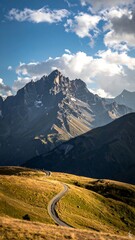 Winding road leading towards a majestic mountain peak