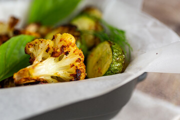 Baked vegetables with golden crust in parchment paper