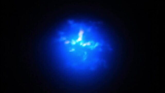 Mysterious glowing blue energy orb pulsing in the darkness.