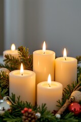 A glowing candle arrangement in a cozy setting holiday decor indoor warm atmosphere close-up serenity