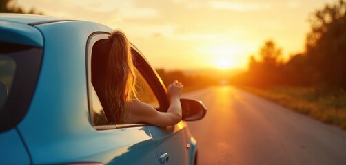Woman enjoys car ride on open road at sunset. Her arm rests out window feeling freedom and summer vacation vibes. Traveling to destination with friends.