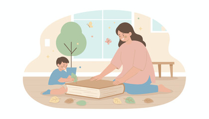 Joyful mother and son pressing colorful autumn leaves into a book learning about nature