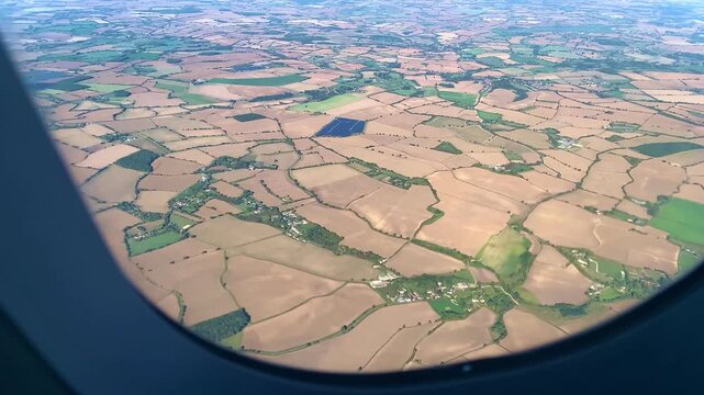 East Anglia English Countryside Panorama From Plane Window, Essex, Suffolk, Cambridgeshire Farmland Below, Aerial Shot, Aerial View Of British Patchwork Lands, England, Britain