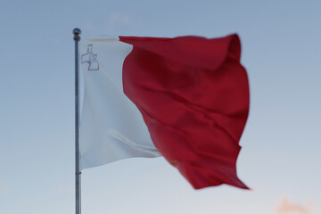 Malta national flag waving in the wind against a clear blue sky, symbolizing freedom, heritage, and pride. Patriotic concept. Travel, creative idea. Politics and Ethnicity