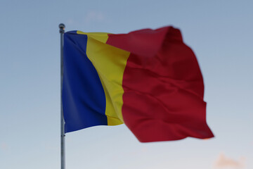 Romanian national flag waving in the wind against a clear blue sky, symbolizing freedom, heritage, and pride. Patriotic concept. Travel, creative idea. Politics and Ethnicity