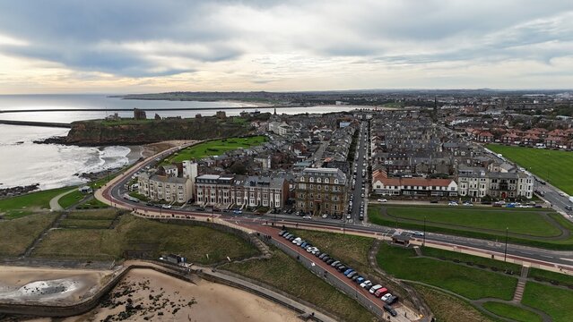 Aerial Drone View of Tynemouth Coastline with Tynemouth Priory, Longsands Beach and North Sea, North East England