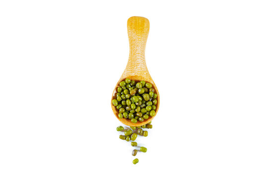 Heap of green mung beans with wooden spoon isolated on white background. - Powered by Adobe