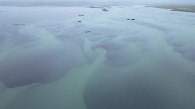 Aerial view of braided glacier river in Iceland, peaceful and vast landscape