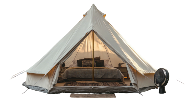 Luxurious glamping tent interior with bed, pillows, and decorative details