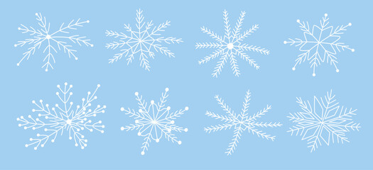 White snowflakes on a blue background in doodle style. Hand-drawn vector snowflake illustration. Festive frosty elements in a minimalist style. Snowflake icons, snow symbol. Snow