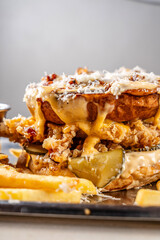 crispy chicken burger with melted cheese and pickles close-up