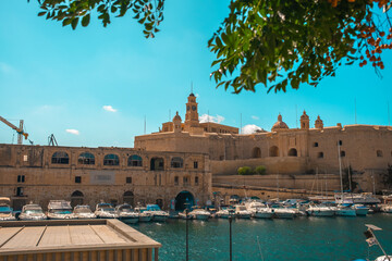 Birgu Waterfront, Malta – Boats, Historic Cathedrals and Old Town View