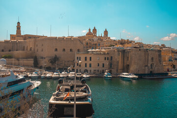 Birgu Waterfront, Malta – Boats, Historic Cathedrals and Old Town View
