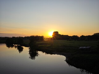 Obraz premium sunset over the river