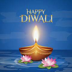 Photo of a glowing diya lamp with the text happy diwali on a blue background, surrounded by lotus flowers floating on water for the festival of lights
