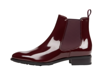 Isolated dark red patent leather Chelsea boot with elastic side panels and black block heel