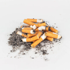 Pile of Cigarette Butts on White Background