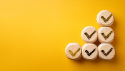 ubes with check mark on yellow background checklist concept with copy space