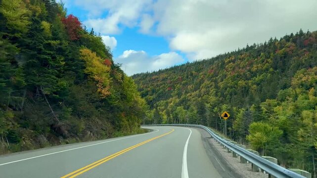 Cape Breton, Canada - September 30, 2025: Traveling by car on the unique Cabot Trail, a 300 km long panoramic road through Nova Scotia.
