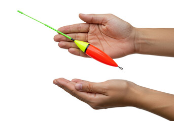 Isolated fishing float in hand ready to use for catching fish at a river or lake setting