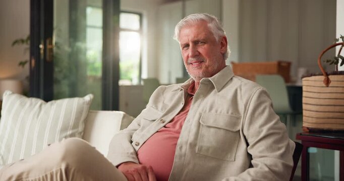 Face, elderly and man on sofa with smile for relax, retirement and peaceful weekend break in home. Comfortable, happy and senior person on couch with confidence, pride and good memory in living room.