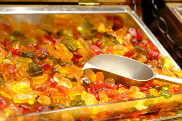 Colorful jelly beans sold in a candy store, close-up. Jelly beans for children. Fun jelly beans for Christmas, birthdays, holidays. Junk food. Sugary foods. Food industry.