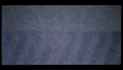 Close-up of VHS video still with pixel dot pattern. Retro analog screen texture in blue tones, perfect for glitch, vintage, and digital art backgrounds.