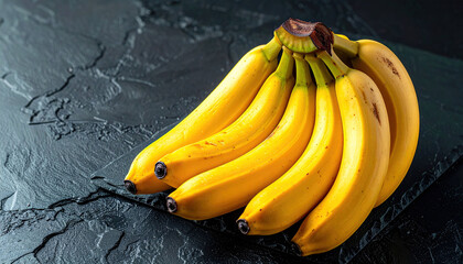 A fresh bunch of ripe yellow bananas, a natural tropical fruit, isolated on a white background for a healthy food snack