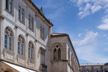 Historic limestone building with arched windows